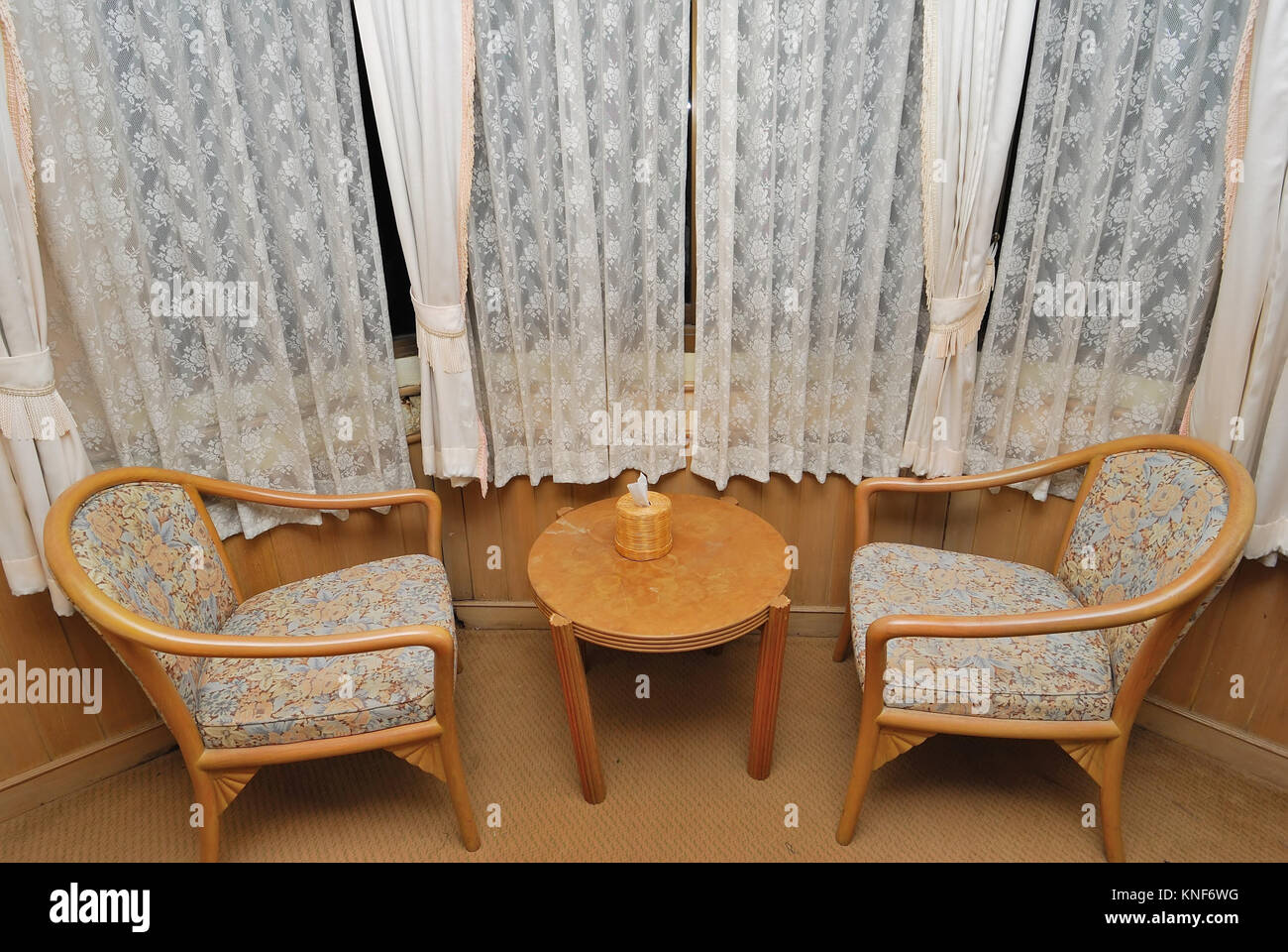 Tea table and chairs for resting in high class hotel room. Suitable for concepts such as travel, tourism, vacation and holiday. Stock Photo