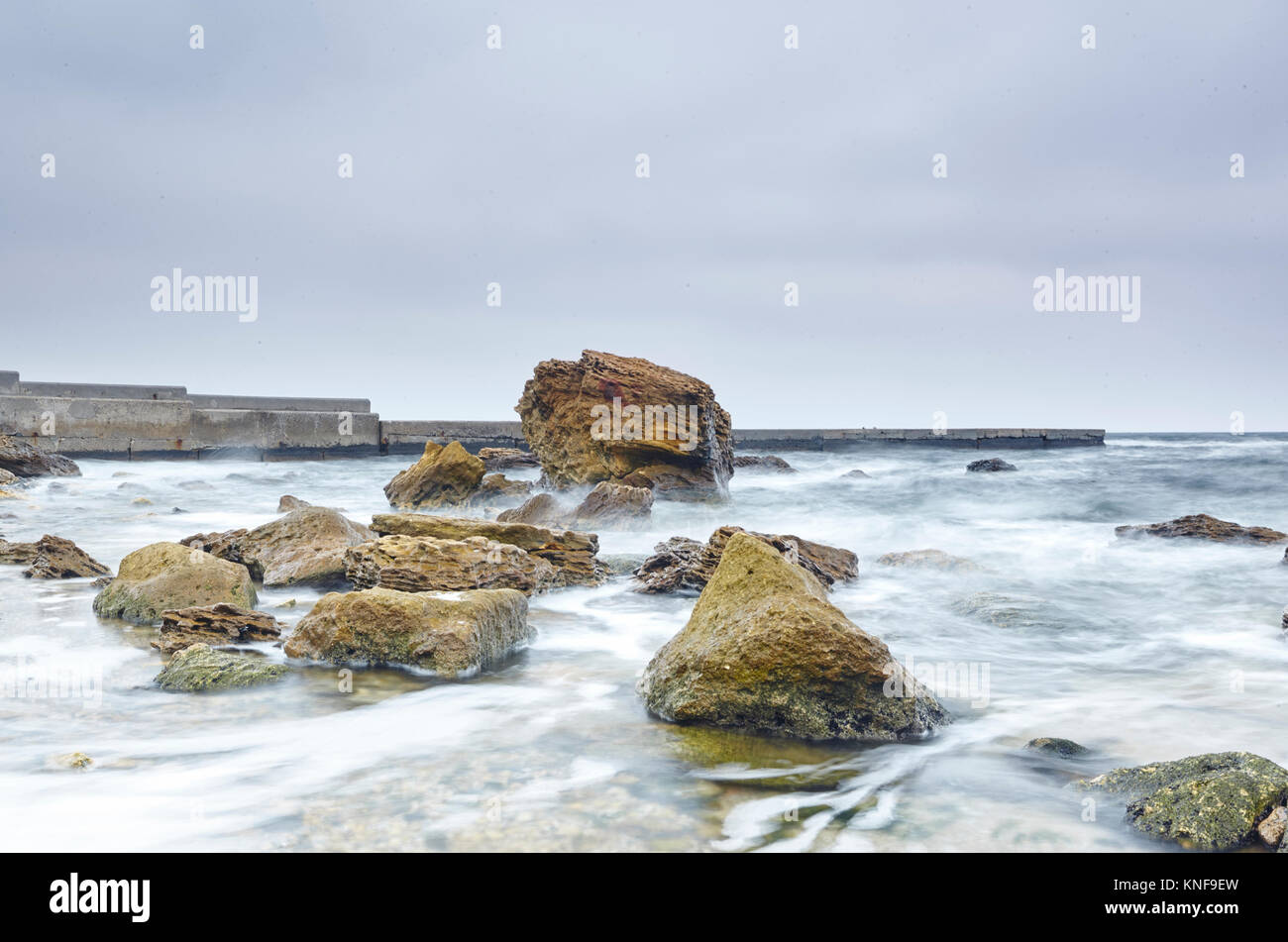 Rocks protruding from sea, Odessa, Odeska Oblast, Ukraine, Europe Stock Photo