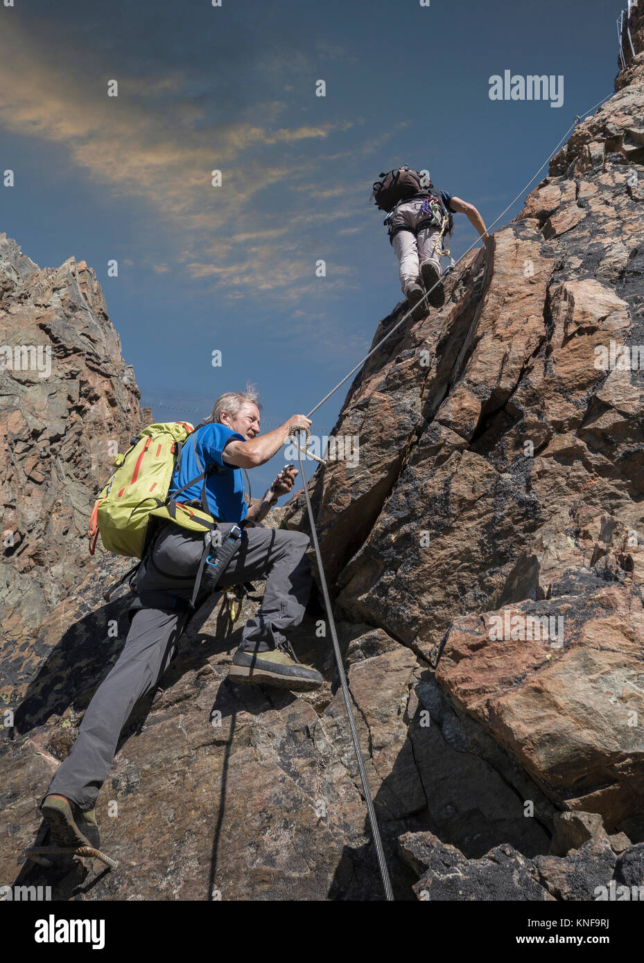 Two male climbers climbing up Jegihorn, Valais, Switzerland Stock Photo