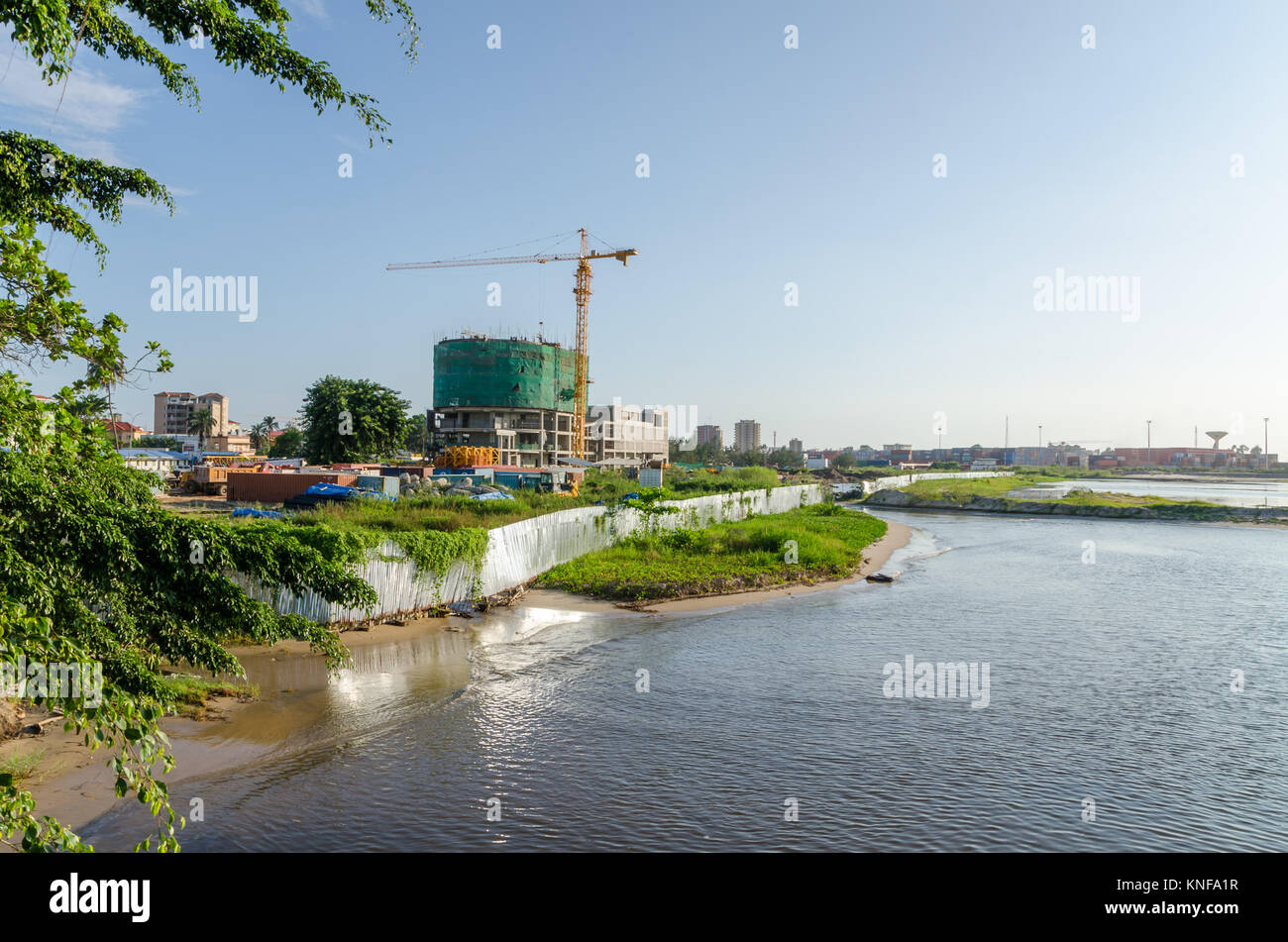 View over construction site and container harbor at coast of Pointe-Noire Stock Photo