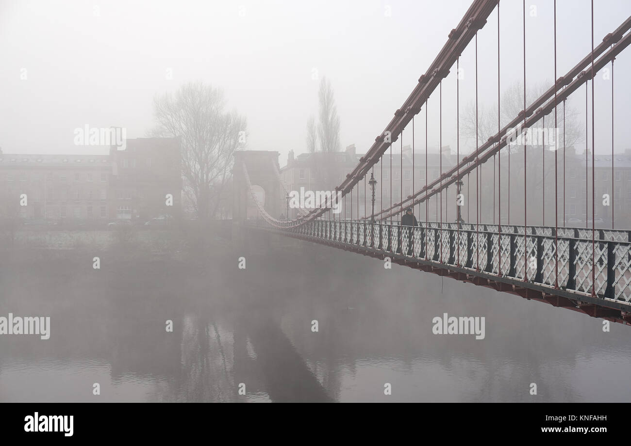 Glasgow, UK, 10th December 2017, South Portland suspension footbridge over the river Clyde in Glasgow in foggy weather. Stock Photo