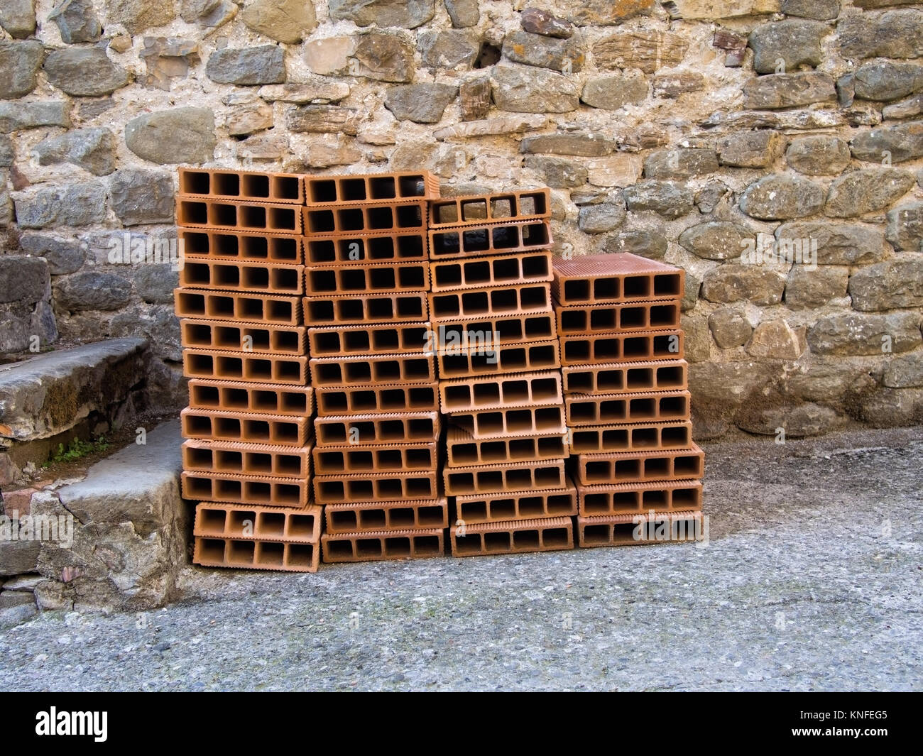 Traditional building material. Known as tavelle, forariti ie holed clay bricks. Stock Photo