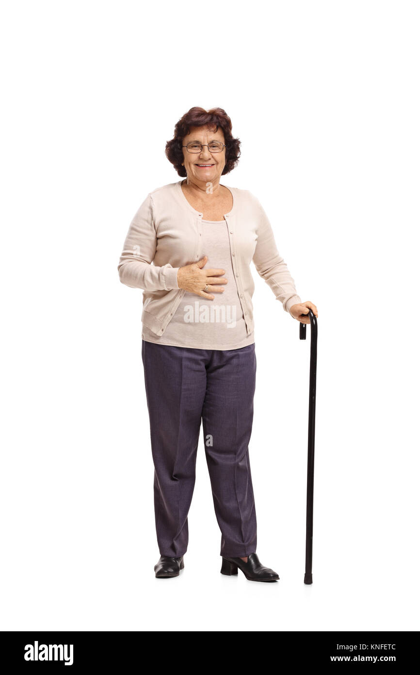 Full length portrait of an elderly woman with a walking cane isolated on white background Stock Photo