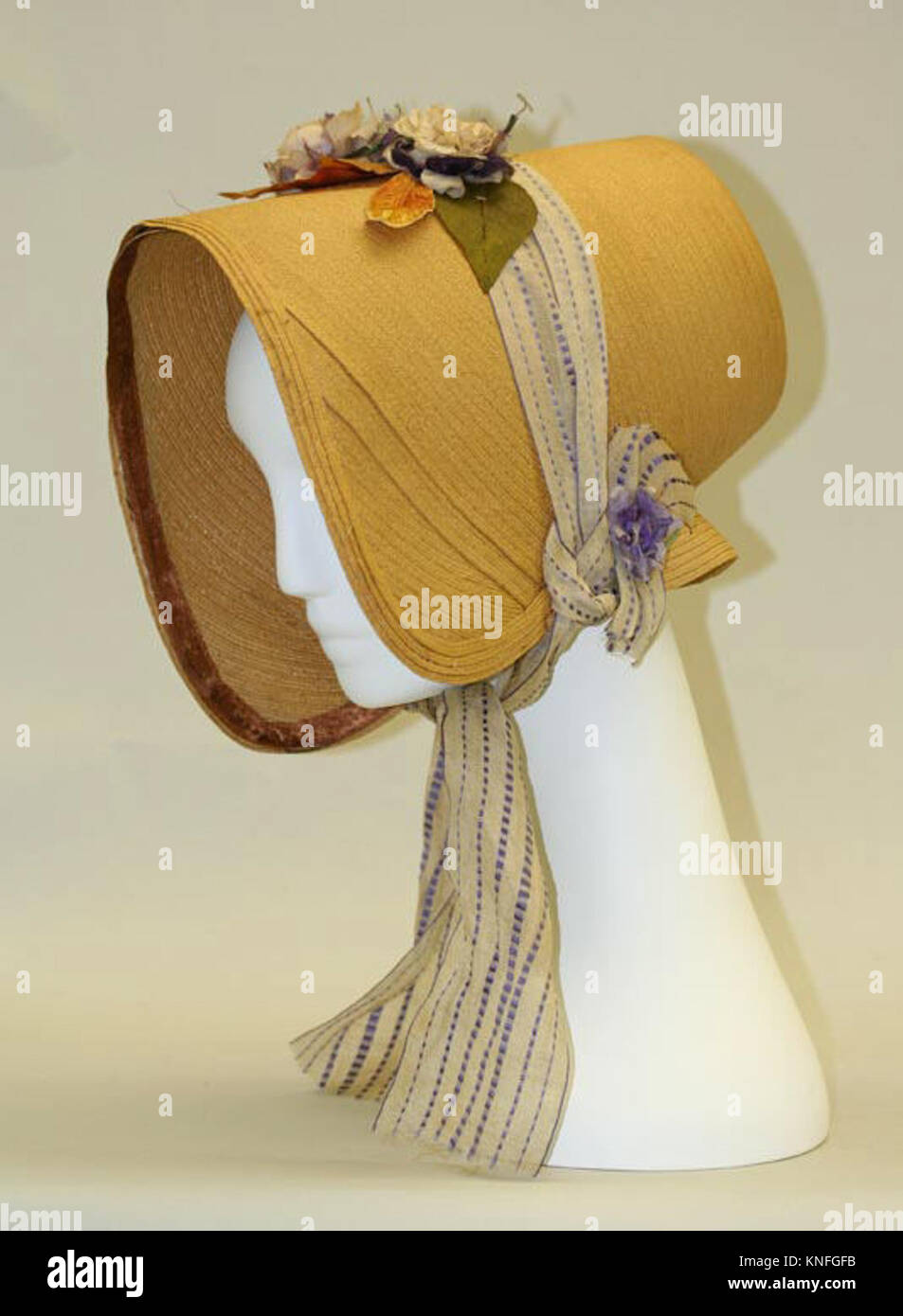The bonnet, made of delicate materials, functions as a stylish ...