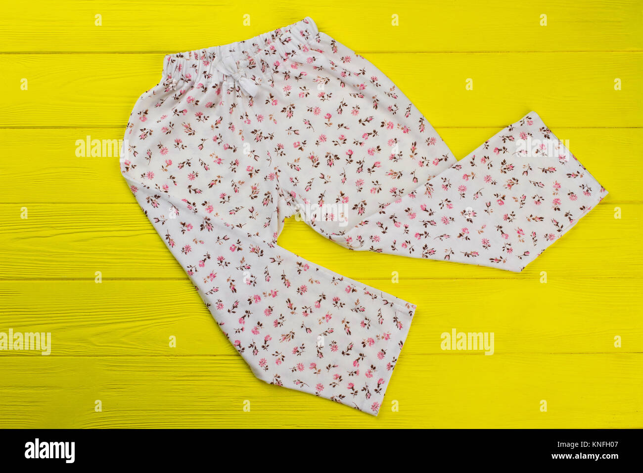 Roomy pants with floral print Stock Photo
