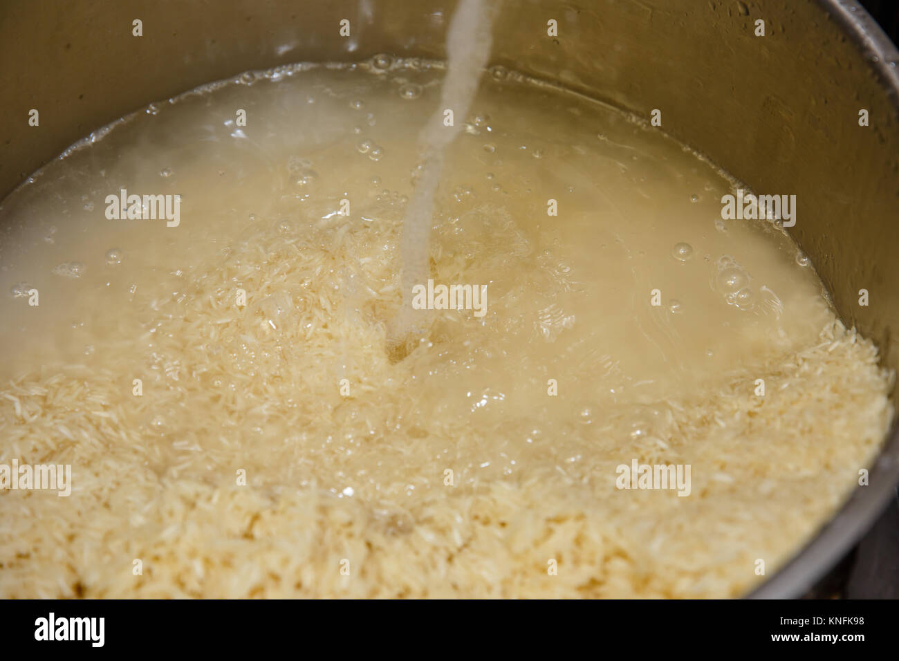 Food Preparation. Washing Rice Stock Photo