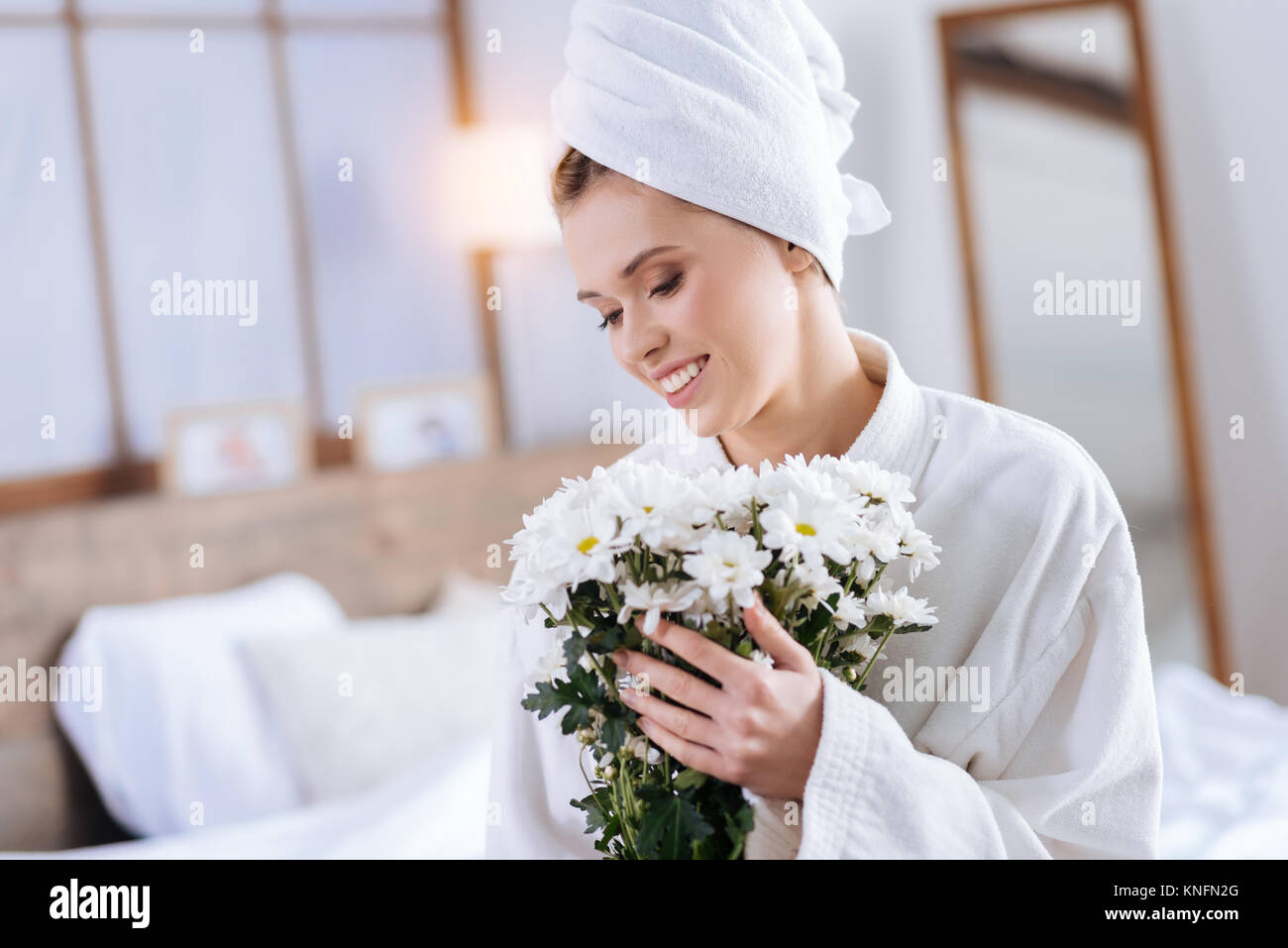 Happy young woman holding bouquet of flowers Stock Photo - Alamy