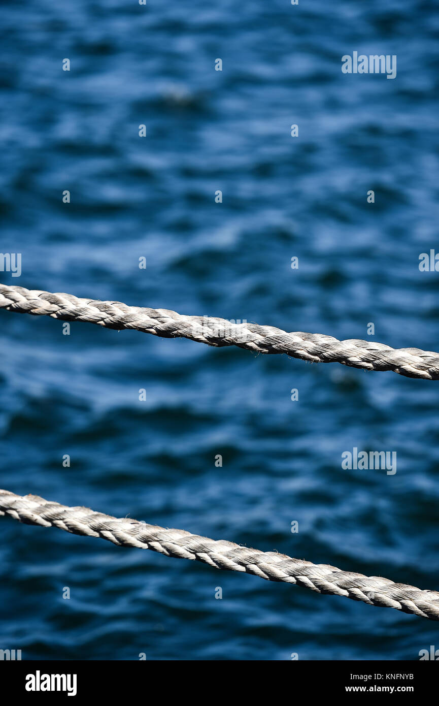 Mooring heavy duty rope used for securing ships in harbor Stock Photo