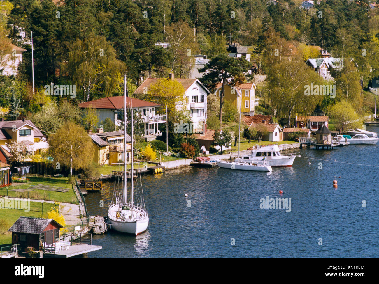 VILLAS and boats by the water in one of Stockholms suburbs 2014 Stock Photo