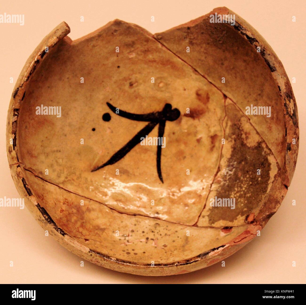 Bowl. Date: 9th century; Geography: Excavated in Iran, Nishapur. Attributed to Iran, Nishapur; Medium: Earthenware; white slip under yellowish glaze; Stock Photo