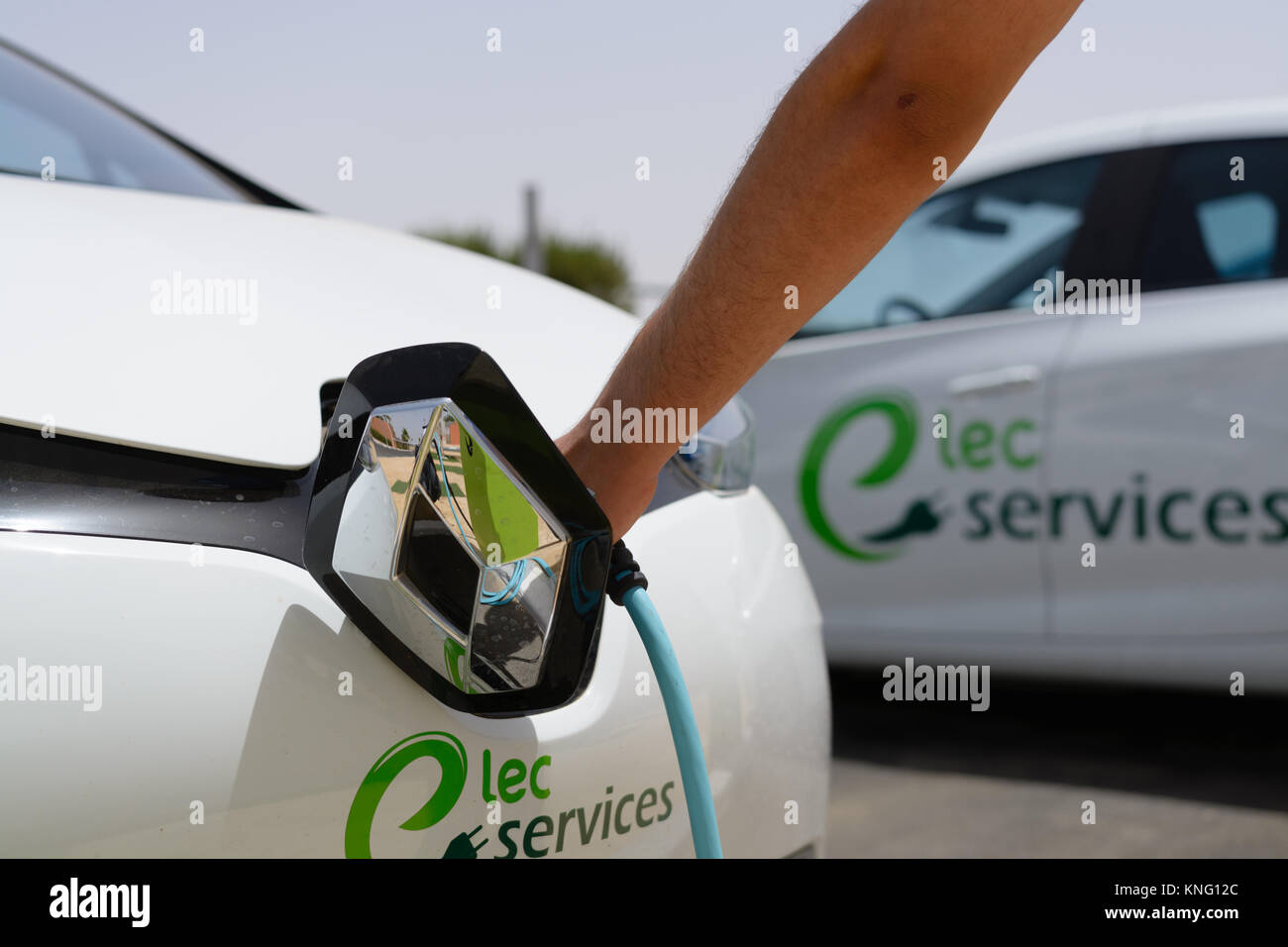 Handheld charging for electric vehicles Stock Photo