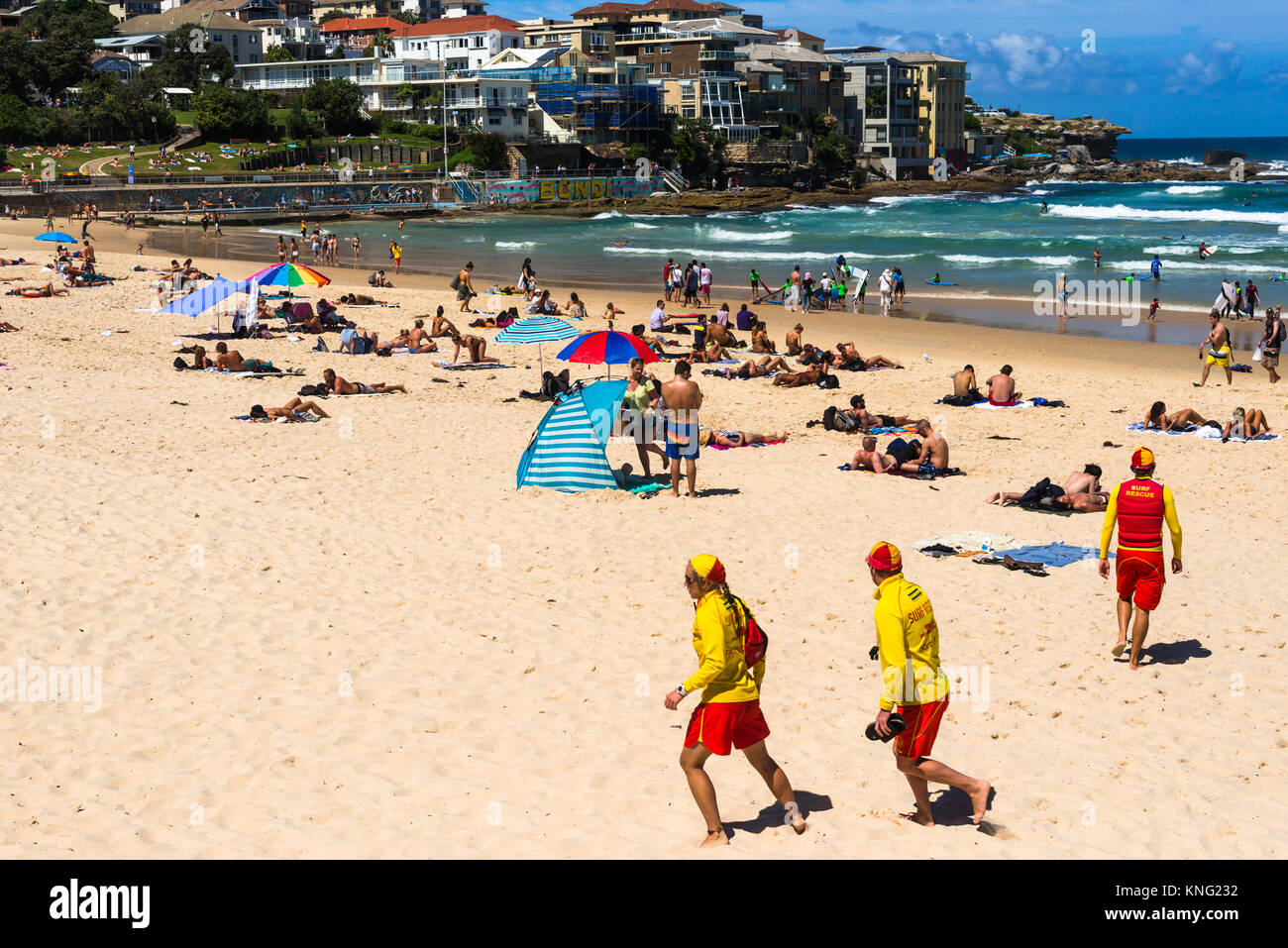Lifeguards running on Bondi beach on a summer's day. Sydney, NSW