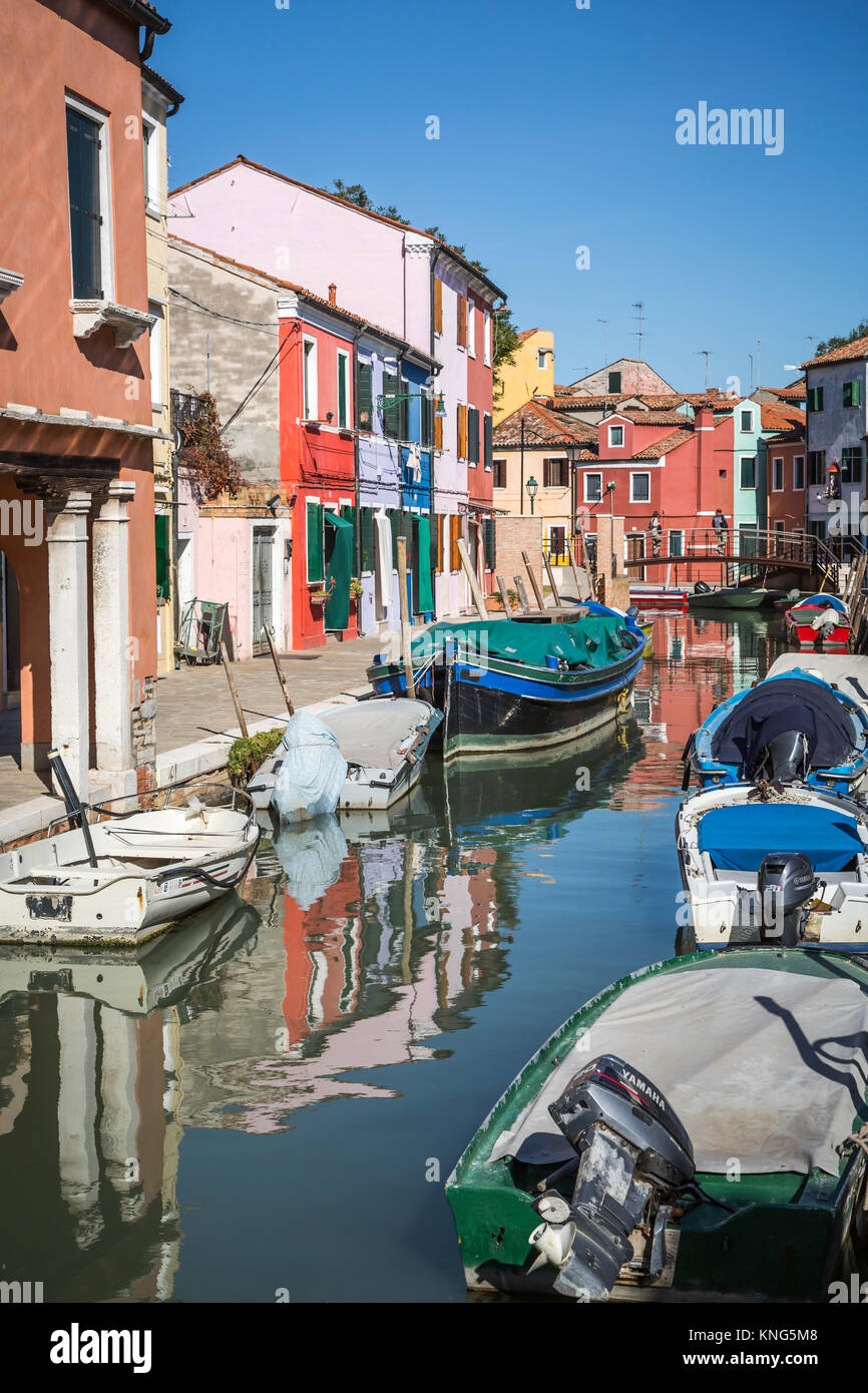 The colorful buildings, canals and boats in the Venetian village of Burano, Venice, Italy, Europe. Stock Photo