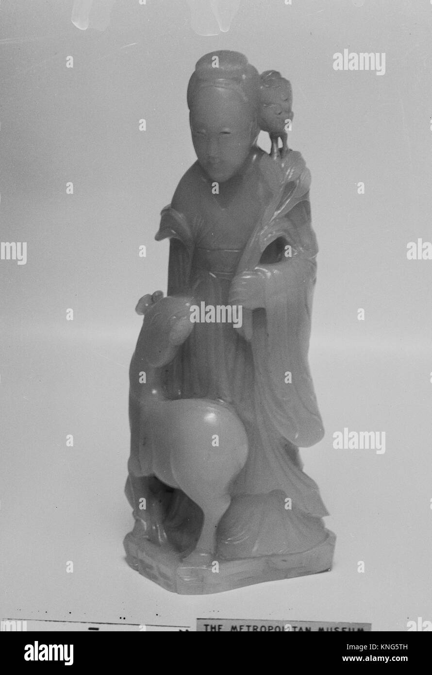 Fairy Figure: He Xiangu. Period: Qing dynasty (1644-1911), Qianlong period (1736-95); Culture: China; Medium: Nephrite; Dimensions: H. 6 1/4 in. Stock Photo