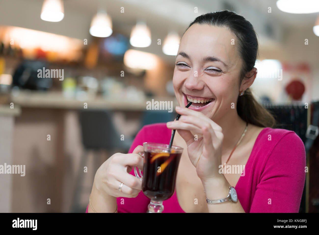 Girl drinks mulled wine at coffee shop Stock Photo Alamy