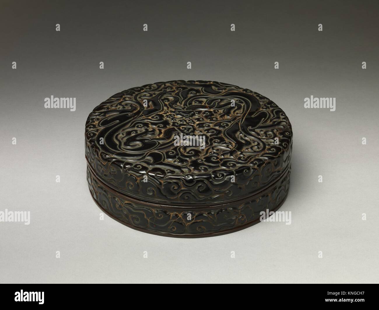 Box with Dragons amid Clouds. Period: Southern Song dynasty (1127-1279); Date: 13th century; Culture: China; Medium: Carved black, red, and yellow Stock Photo