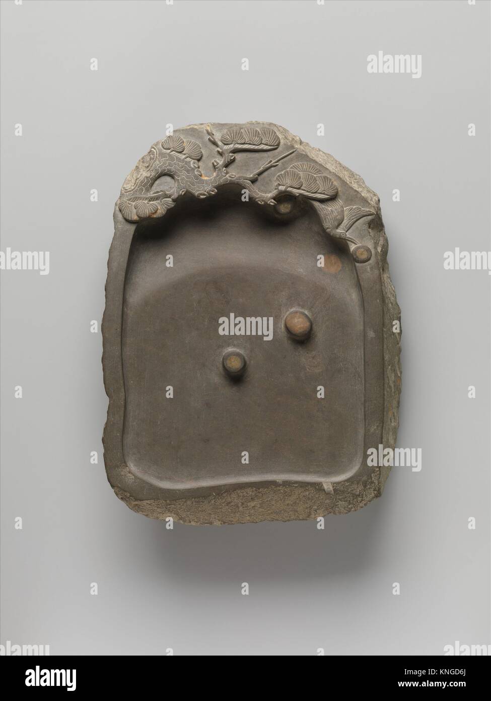 Inkstone with Pine Tree and Bird. Period: Ming dynasty (1368-1644); Date: 16th century; Culture: China; Medium: Slate; Dimensions: H. 7 in. (17.8 Stock Photo