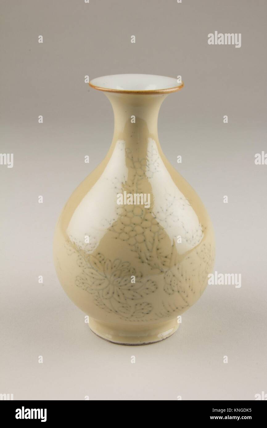 Vase. Period: Qing dynasty (1644-1911); Date: 18th century; Culture: China; Medium: Porcelain with café-au-lait glaze over an incised design; Stock Photo