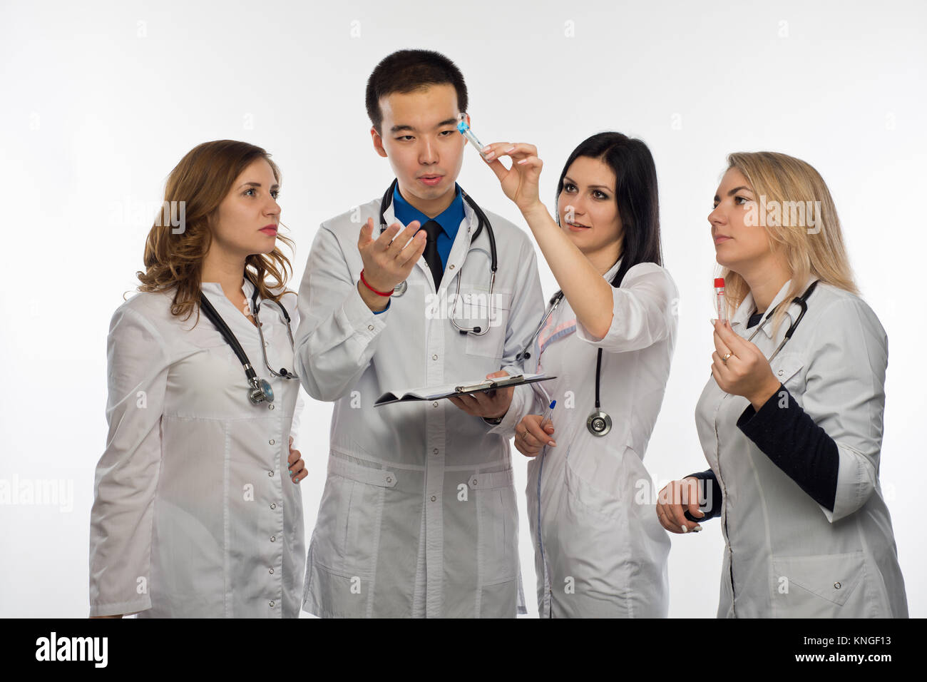 The mana doctor and three female doctors have fun discussing the test