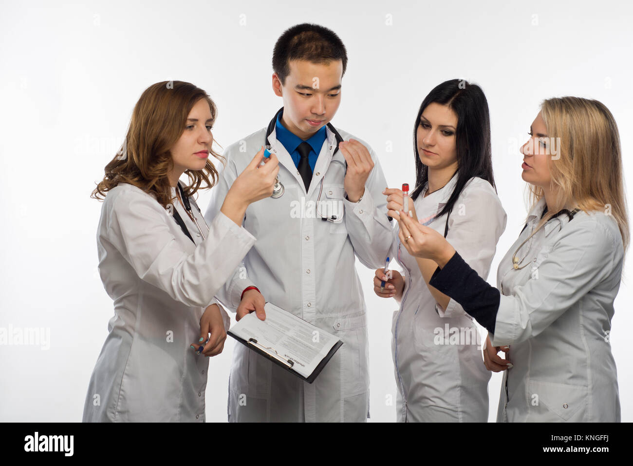 The mana doctor and three female doctors have fun discussing the test