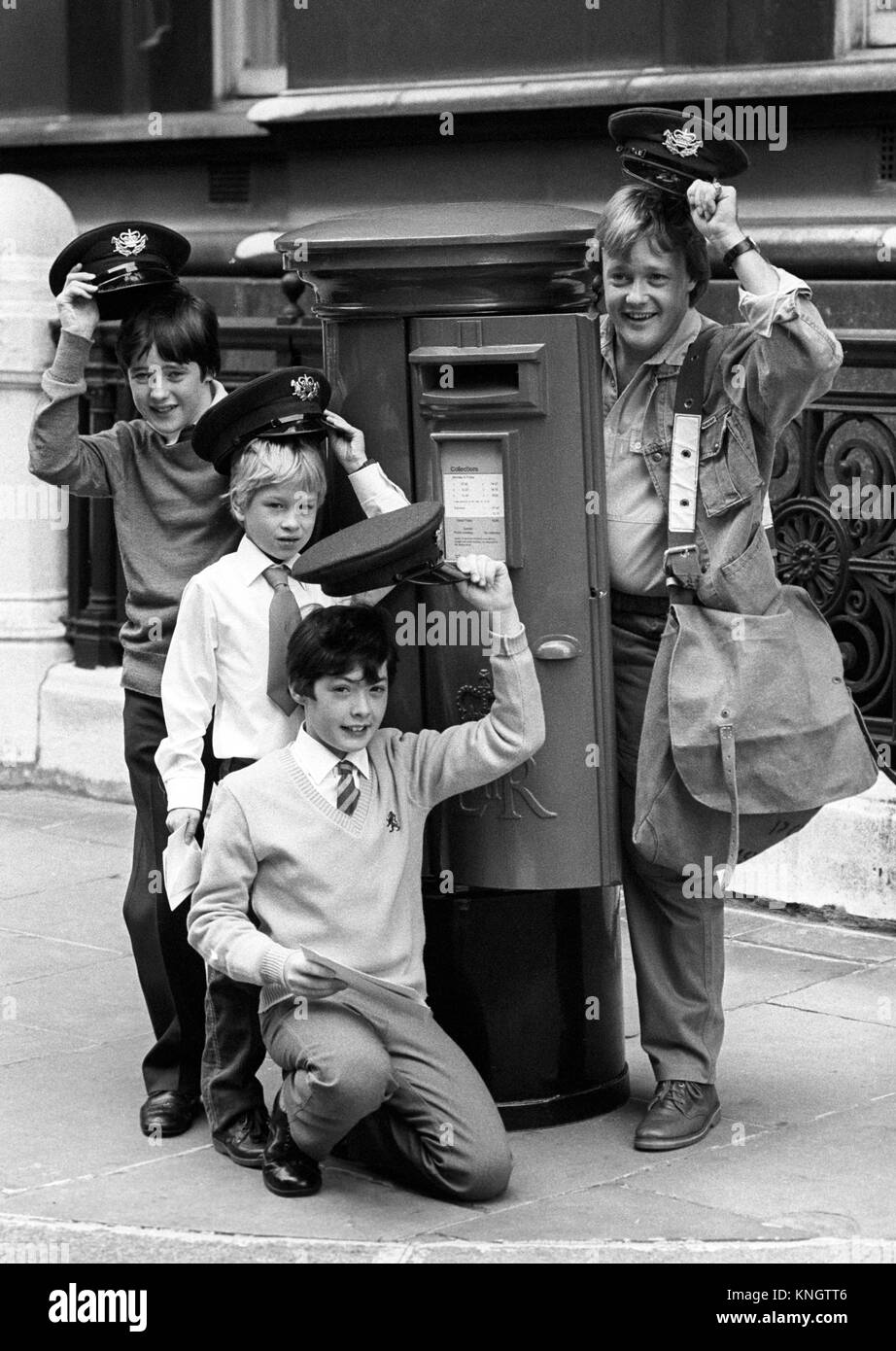Television presenter Keith Chegwin outside the Post Office headquarters in London, after presenting John Goodier (back), 14, of Merseyside, Mark Thomas Trevithick (centre), 8, of Cornwall, and Jason Davies (front), 12, of Wales, with their prizes of £250 each for winning their sections in the national Post Office letter writing competition. Stock Photo
