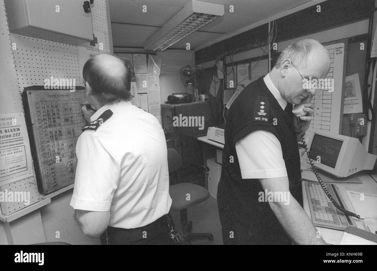 Prison officers at work in wing office, HMP Winchester, Winchester, Hampshire, United Kingdom. 10 May 2001. Stock Photo