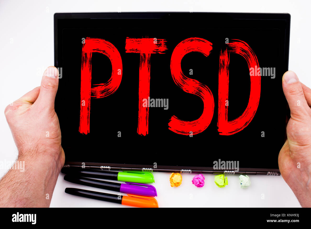 PTSD Post-Traumatic Stress Disorder text written on tablet, computer in ...