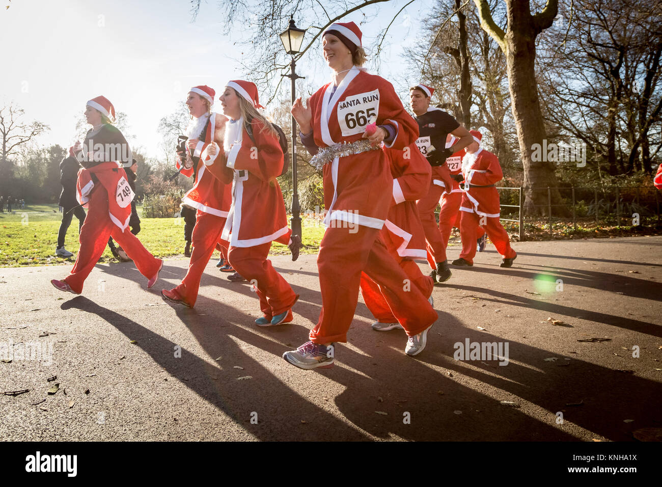 London, UK. 9th Dec, 2017. Hundreds of Santas attend the annual 5km Santa Run in Battersea park. Credit: Guy Corbishley/Alamy Live News Stock Photo