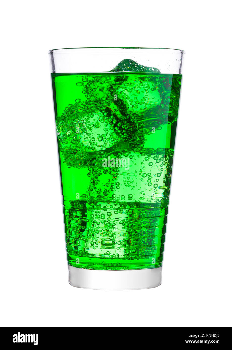 Glass of blue energy carbonated soda drink with ice on white background ...