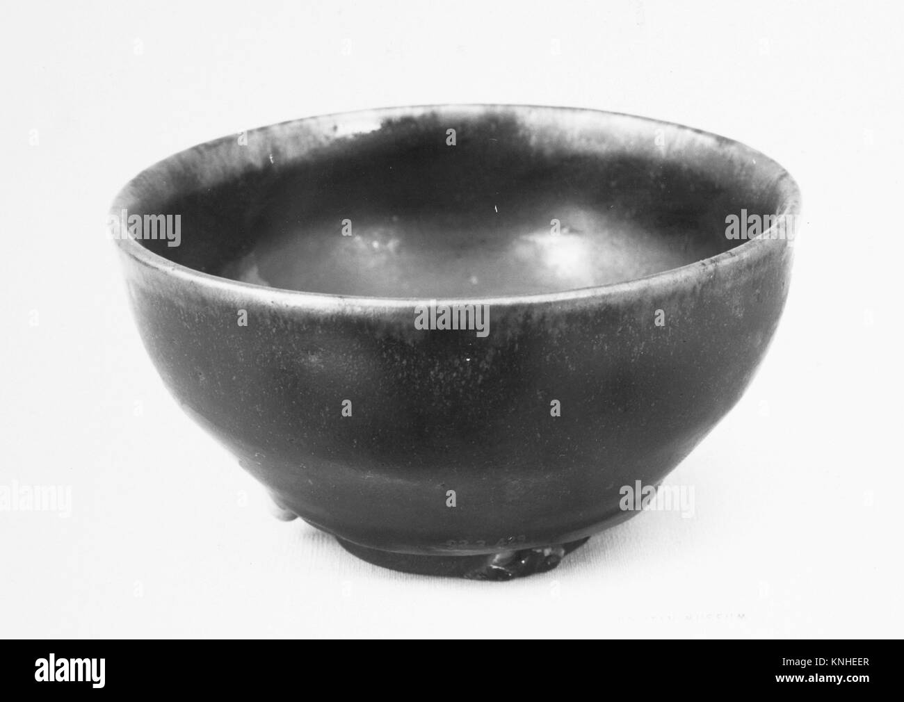 Cup. Date: 1900; Culture: Japan; Medium: Dark brown clay covered with a brown glaze with froth (Satsuma style); Dimensions: H. 2 5/8 in. (6.7 cm); Stock Photo