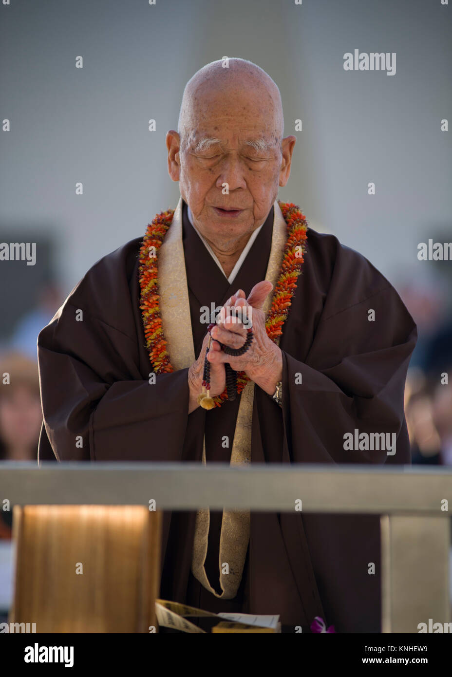 Buddhist monk Tendai Mission Bishop Ryokan Ara delivers a blessing during the Blackened Canteen ceremony at the USS Arizona Memorial during the 75th anniversary commemoration of the World War II attacks on Pearl Harbor December 6, 2016 in Pearl Harbor, Hawaii. The blackened canteen is a relic of a 1945 air raid over Japan and is used for pouring bourbon whiskey as an offering to the fallen in the waters of Pearl Harbor.(photo by PO2 Somers Steelman via Planetpix) Stock Photo