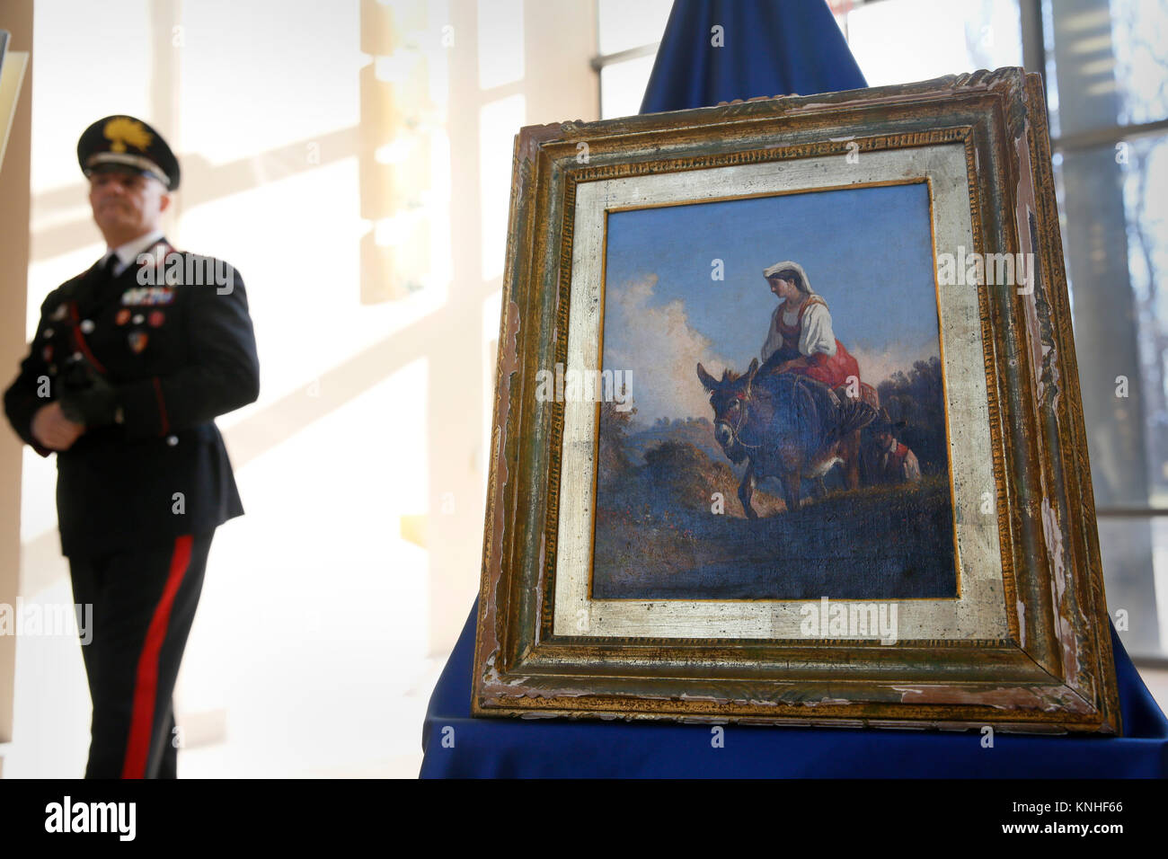 An Italian Carabinieri officer guards the Carelli painting during a repatriation ceremony at the Italian Embassy December 9, 2016 in Washington, DC. The painting was stolen from a private residence in Naples in 2001, and was later sold to an art dealer at a Pennsylvania auction house in 2014. (photo by Glenn Fawcett  via Planetpix) Stock Photo
