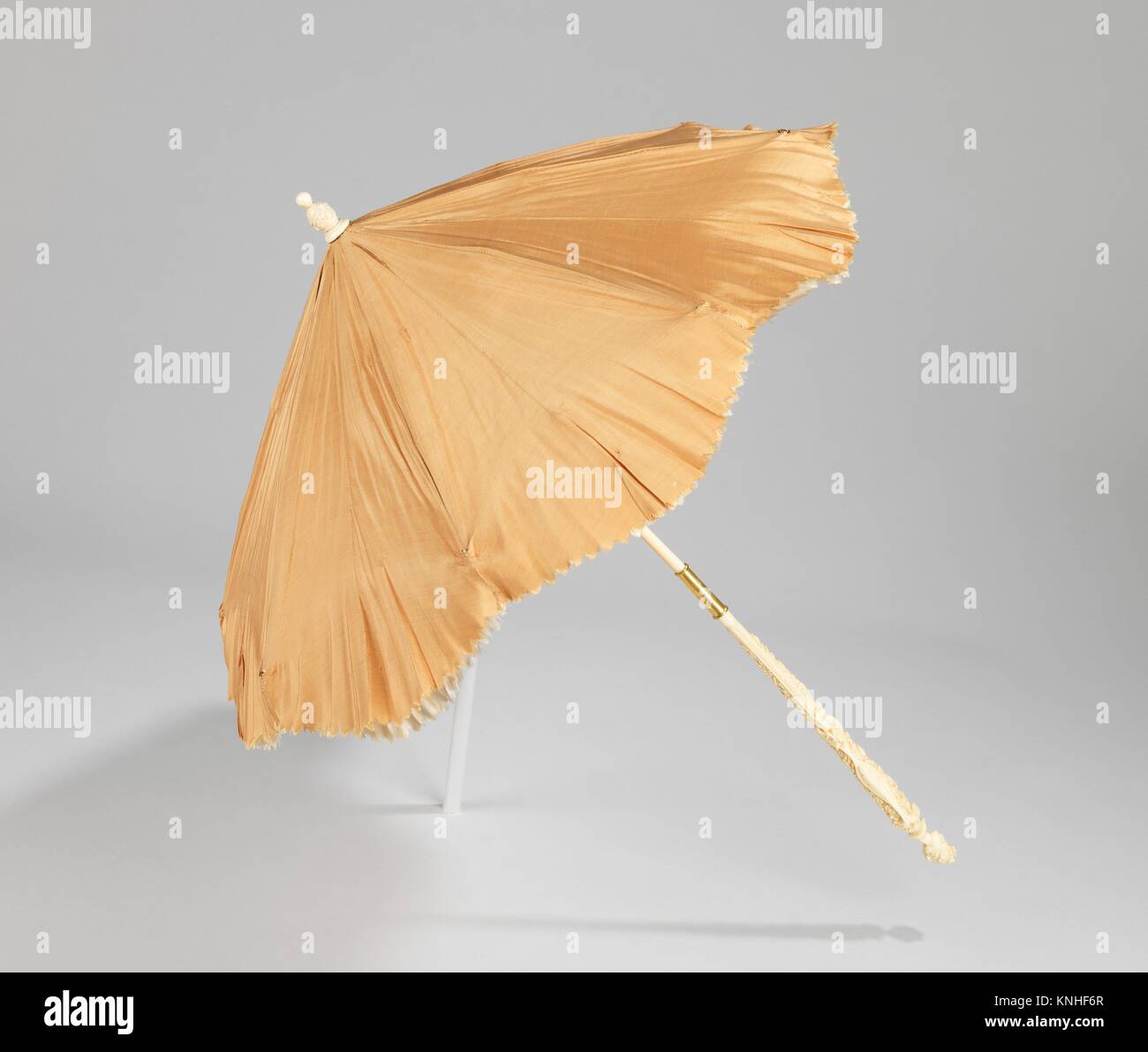 Parasol. Designer: Dupuy (French); Date: 1868; Culture: French; Medium: silk, ivory, metal Stock Photo