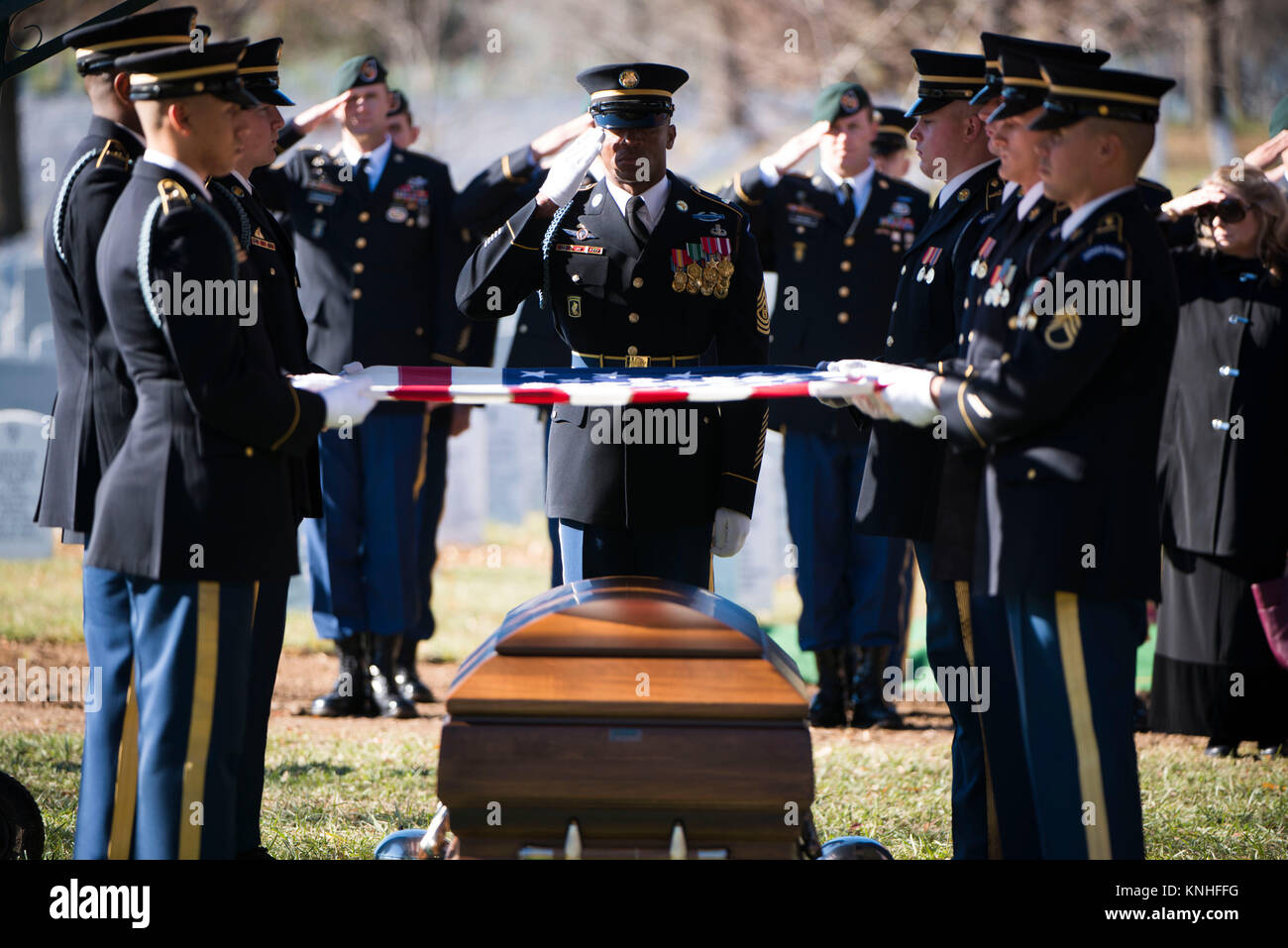 U.S. soldiers hold a flag over the casket of deceased Special Forces soldier James Moriarty during a graveside service at the Arlington National Cemetery December 5, 2016 in Arlington, Virginia. Moriarty was one of three Special Forces soldiers killed in Jordan in November.(photo by Rache Larue  via Planetpix) Stock Photo