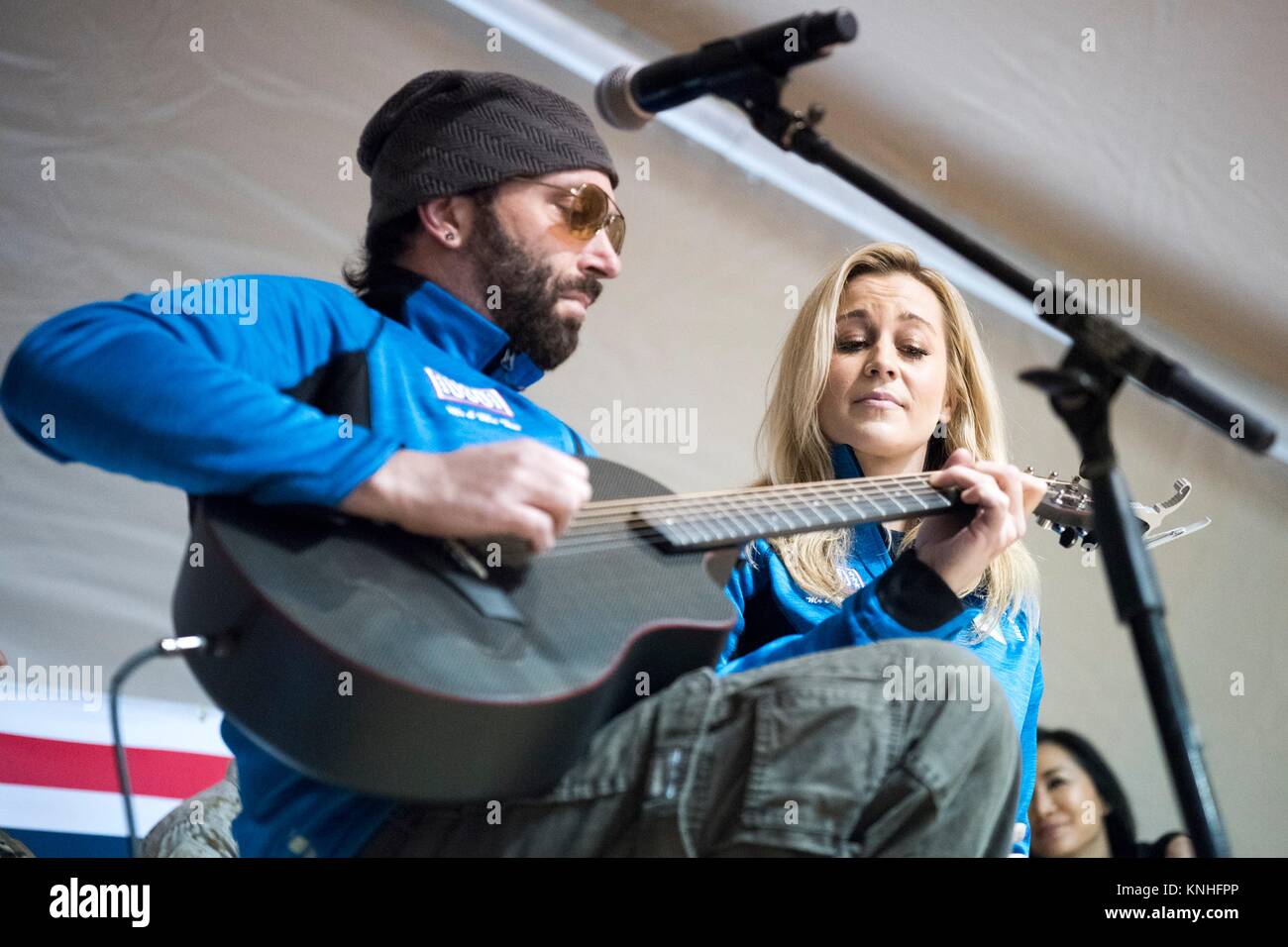 Guitarist Dave Baker and country music singer Kellie Pickler perform for U.S. troops during the CJCS USO Holiday Tour December 25, 2016 in Iraq. (photo by PO2 Dominique A. Pineiro  via Planetpix) Stock Photo