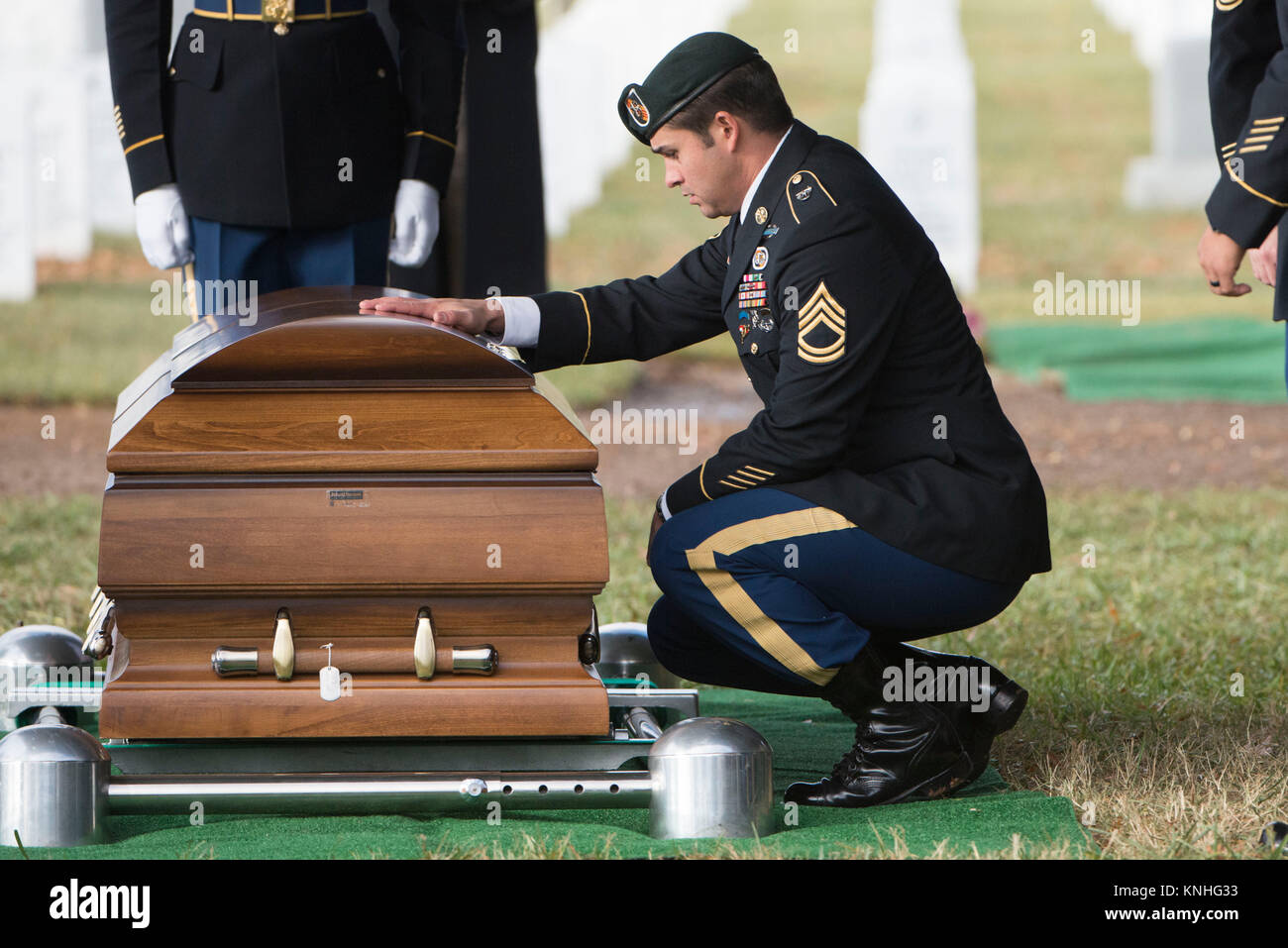 A U.S. Special Forces soldier approaches the casket of deceased soldier Kevin McEnroe during his graveside service at the Arlington National Cemetery December 5, 2016 in Arlington, Virginia. McEnroe was one of three Special Forces soldiers killed in Jordan in November.(photo by Rache Larue  via Planetpix) Stock Photo