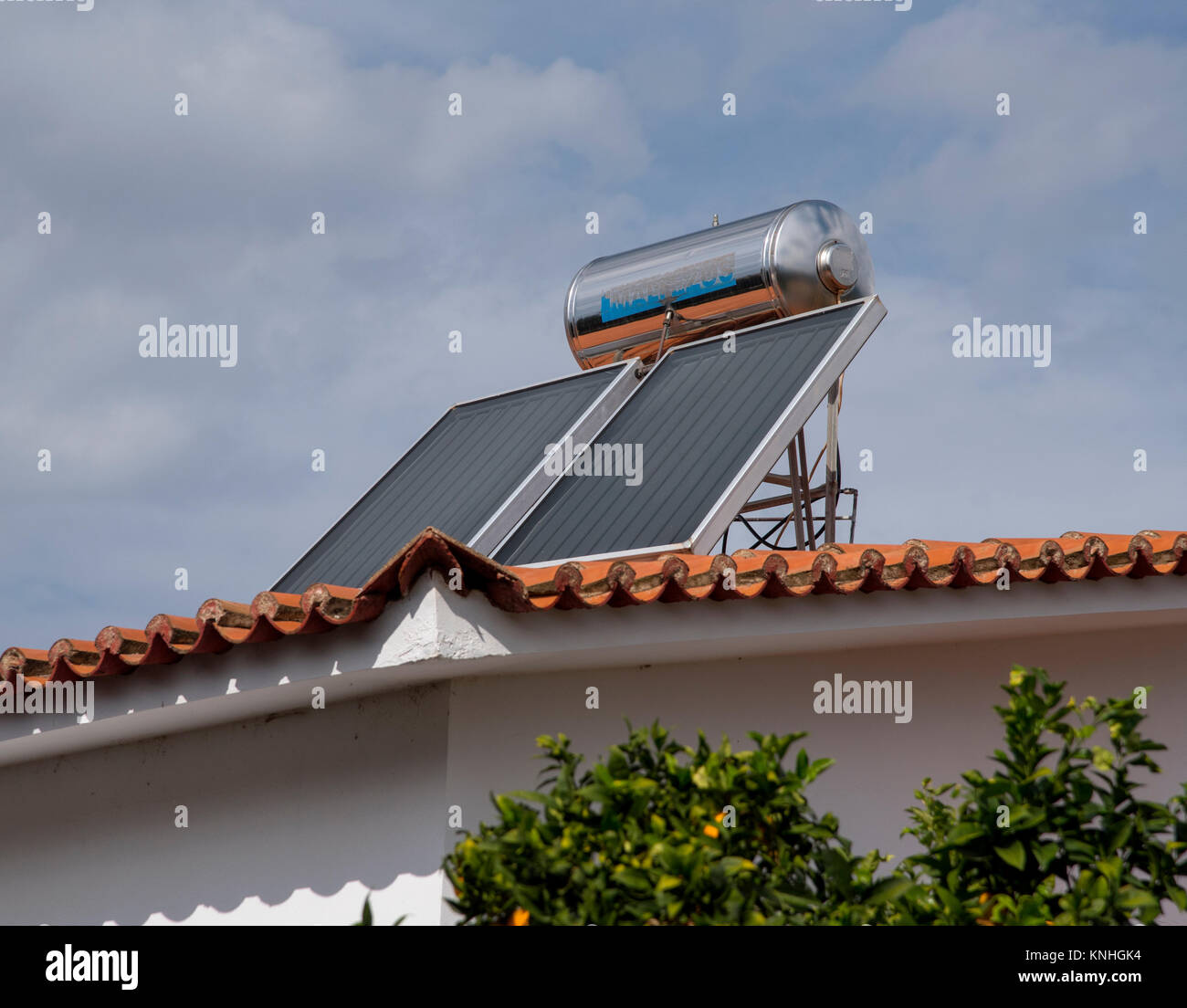 Solar hot water tank on a roof top in rural Greece, now seen on almost all homes Stock Photo