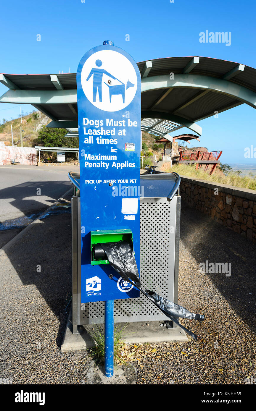 Dog bag dispenser and warning sign, Australia Stock Photo