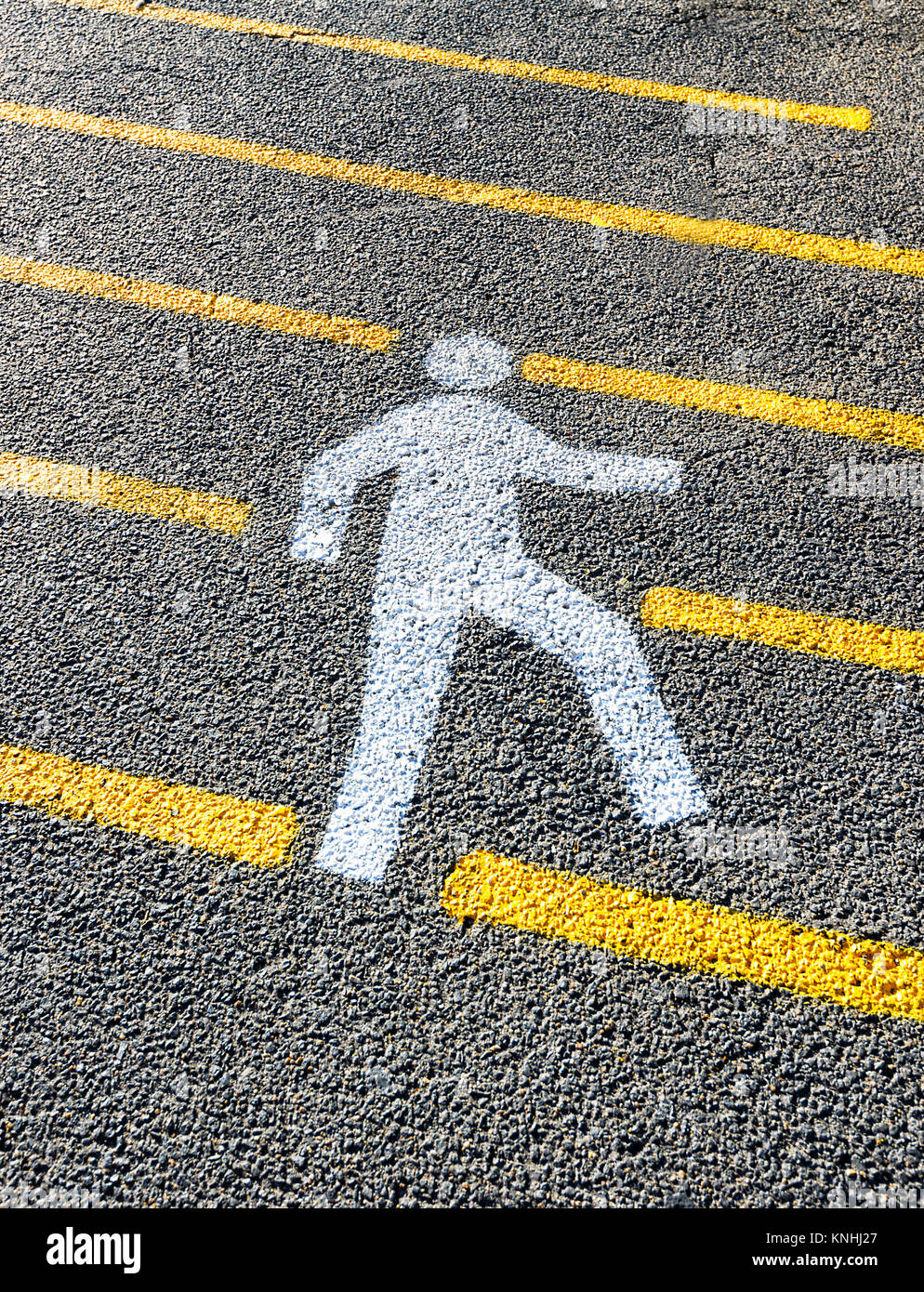 Silhouette of a pedestrian crossing painted on the road, Port Douglas, Far North Queensland, FNQ, QLD, Australia Stock Photo
