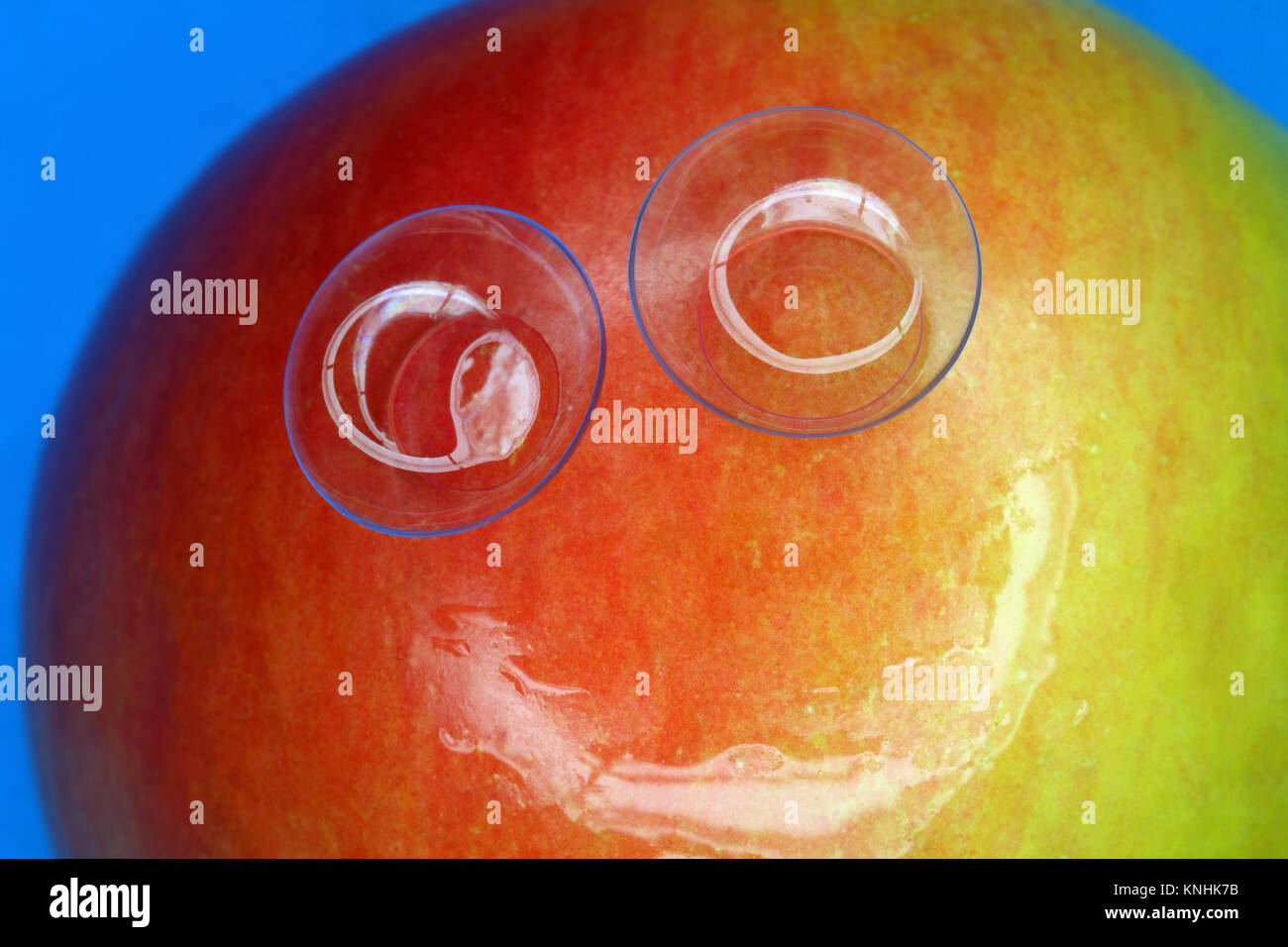 Two soft contact lenses on the glossy surface of apple Stock Photo Alamy