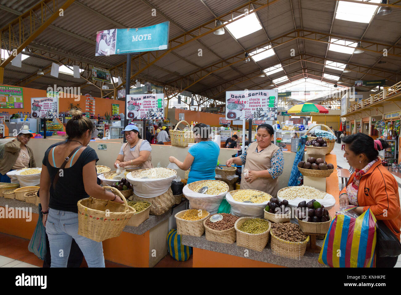 Stallholders and local people shopping, indoor food market, Gualaceo market, Gualaceo, Ecuador South America Stock Photo