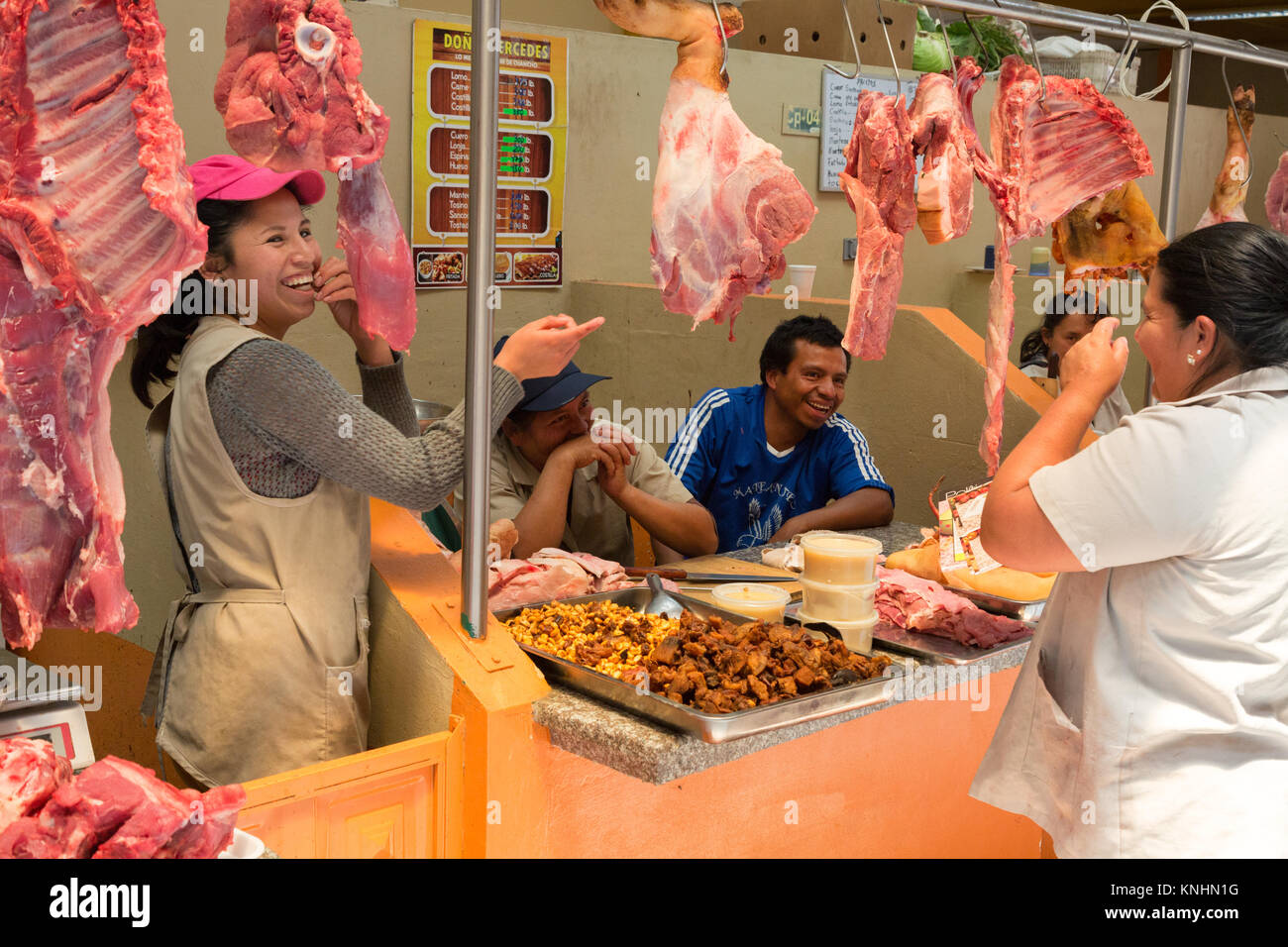 Stallholders and people shopping at the meat market, Gualaceo town