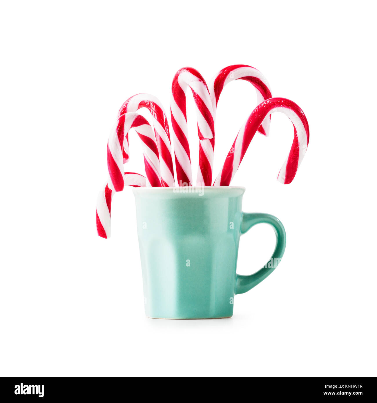 Christmas candy canes in cup isolated on white background clipping