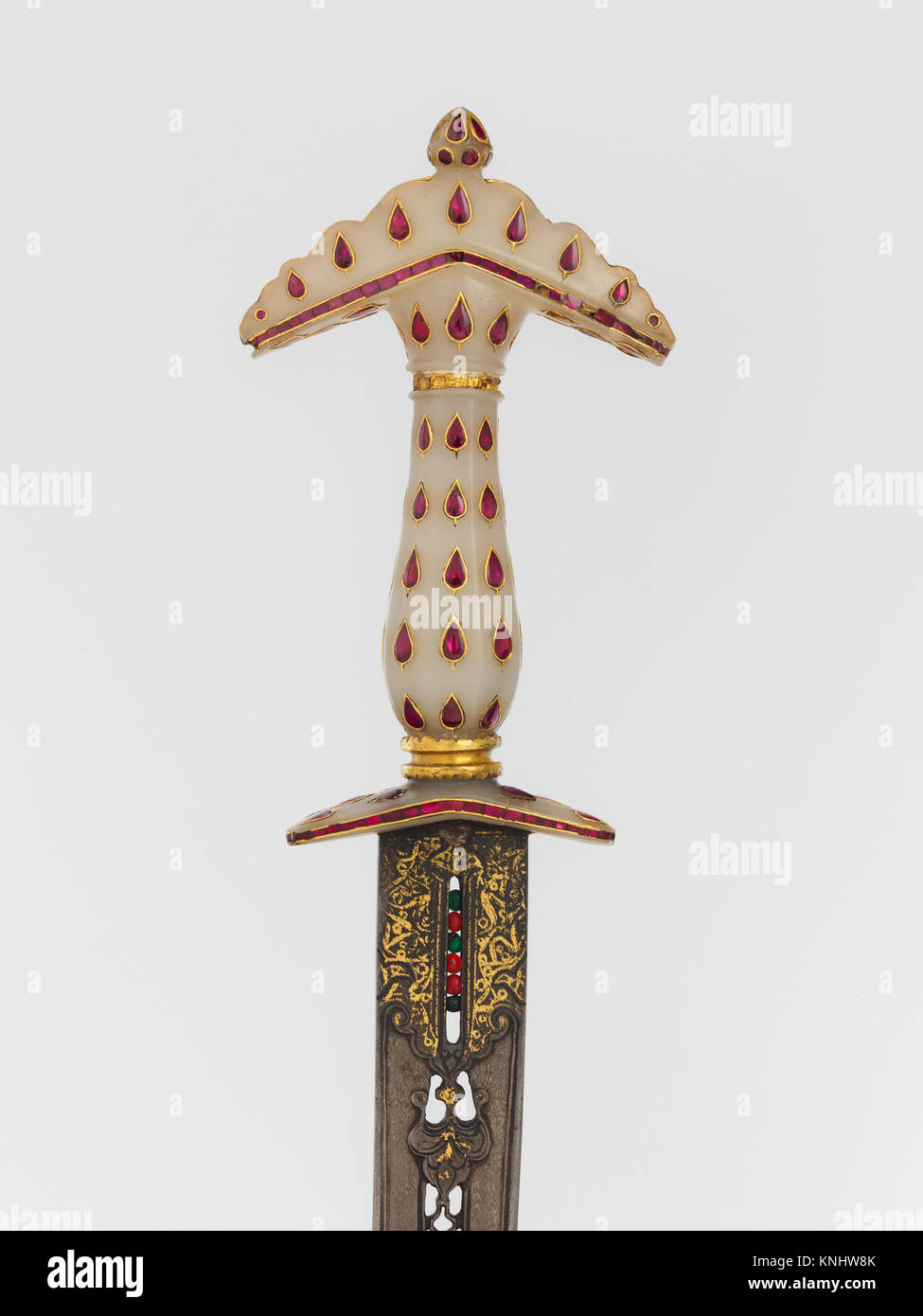 This dagger with its sheath showcases detailed craftsmanship in both ...