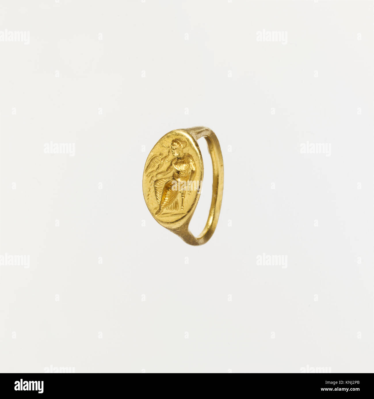 Gold ring with intaglio of seated woman and flying Eros, Period: Classical, 2nd half of the 5th century BCE, Greek, Medium: Gold Stock Photo