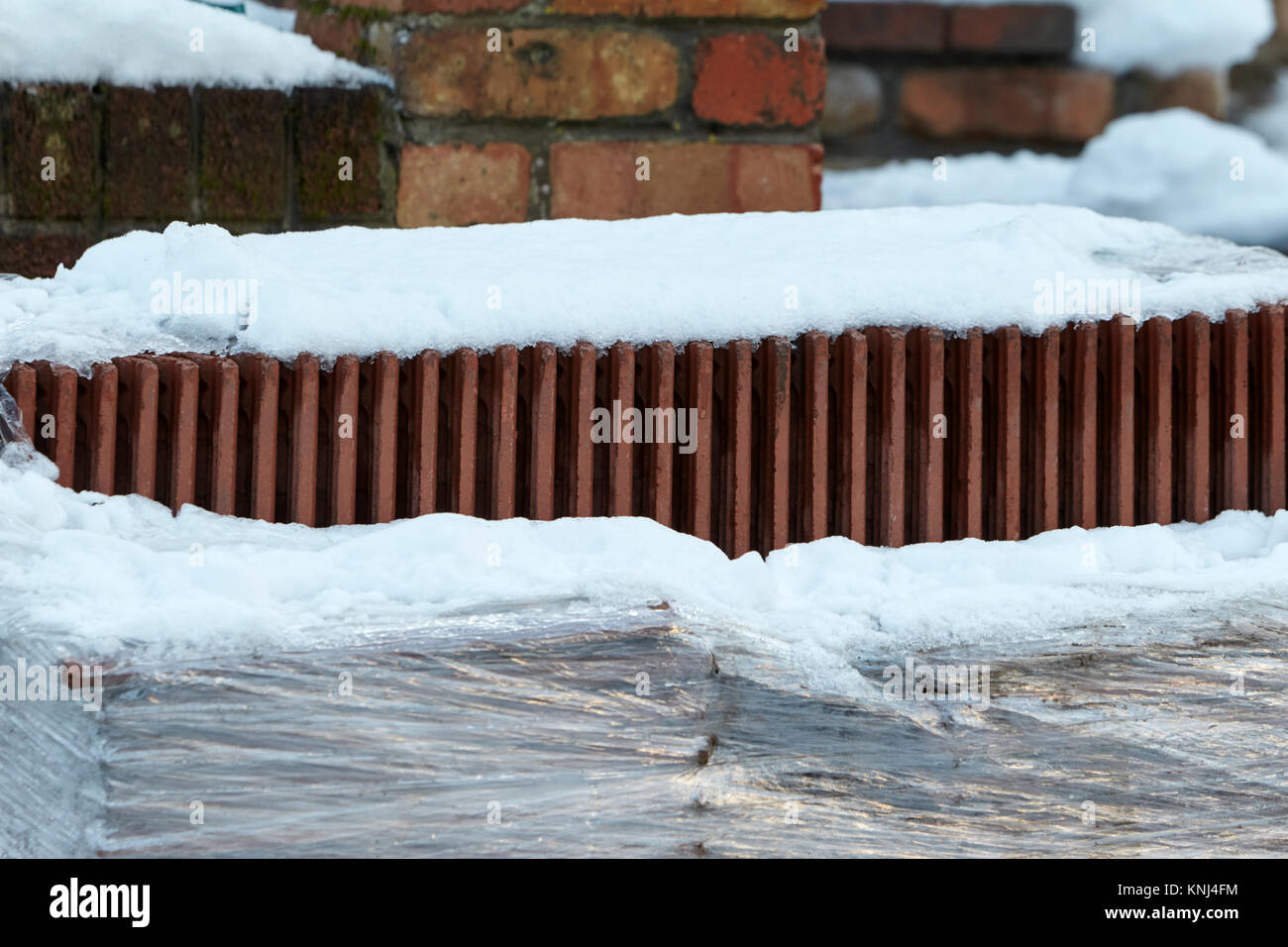 snow covered materials due to building work on hold due to bad weather newtownabbey northern ireland uk Stock Photo