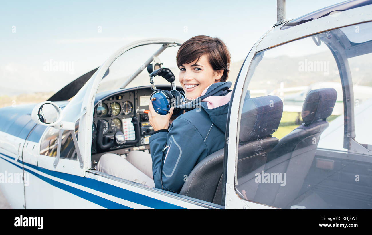 Female pilot smiling in cockpit hi-res stock photography and images - Alamy