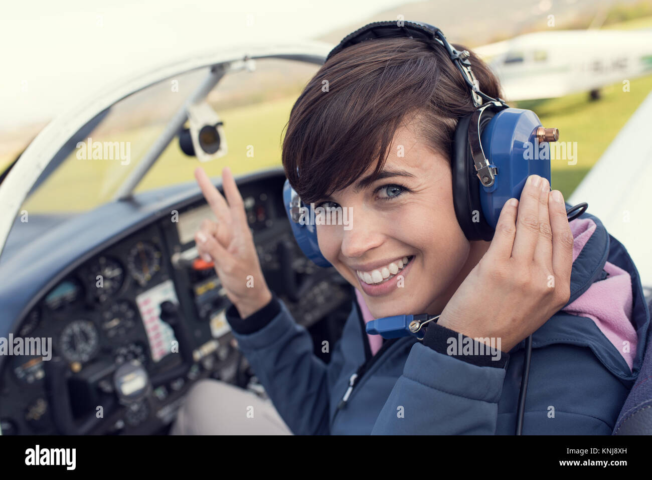 Female pilot smiling in cockpit hi-res stock photography and images - Alamy