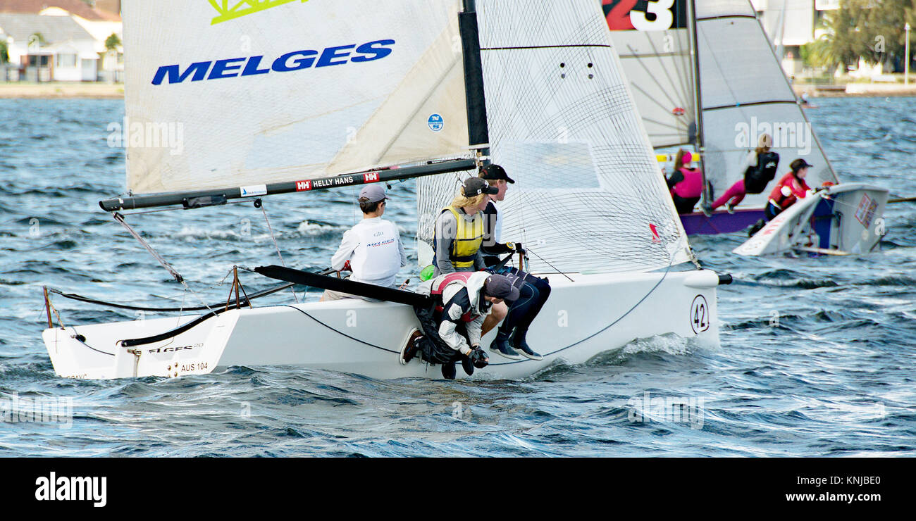 Lake Macquarie, Australia - April 16. 2013: Children competing in the Australian Combined High School Sailing Championships. Young contestants raced Stock Photo