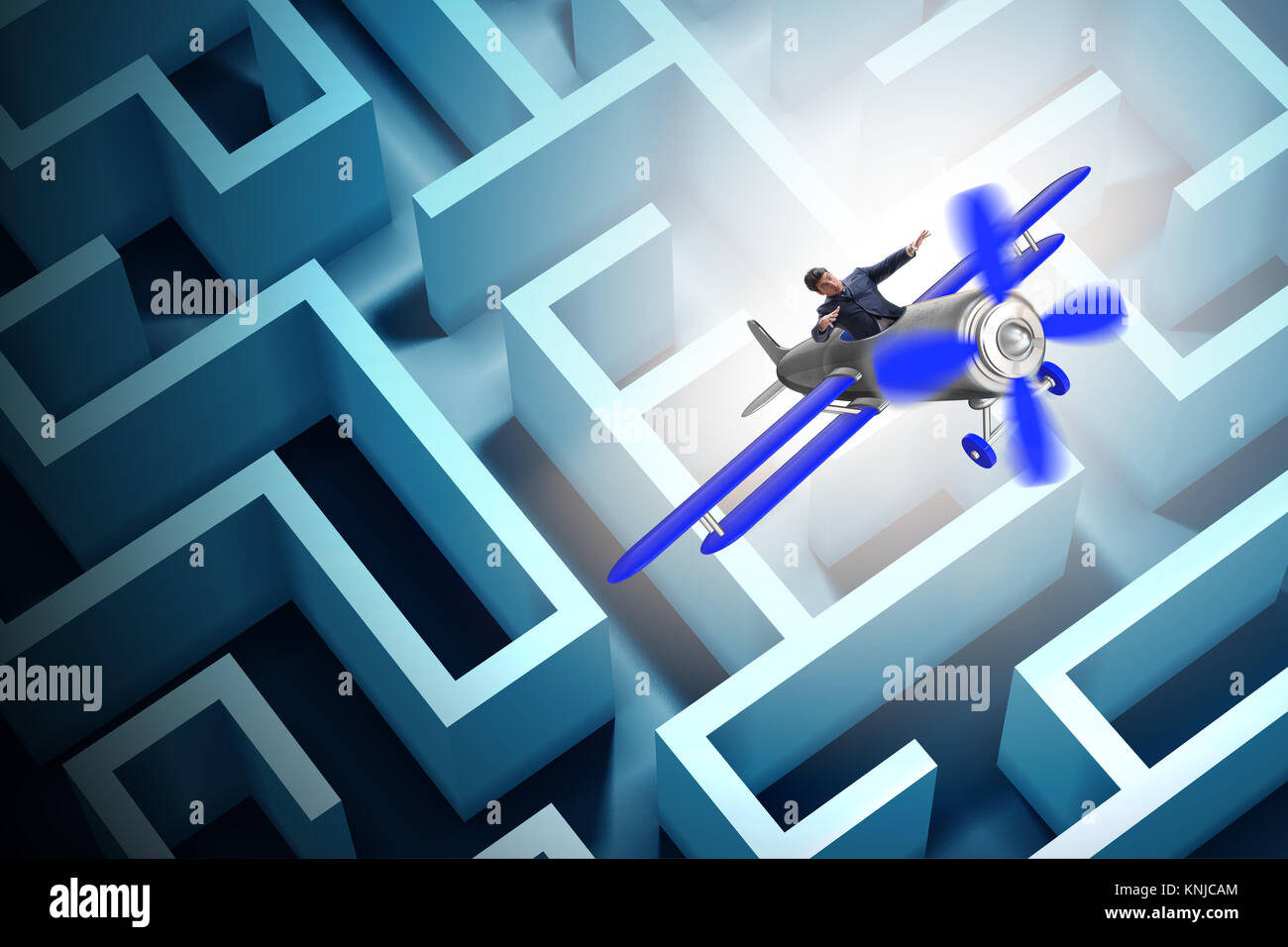 Businessman escaping from maze on airplane Stock Photo Alamy